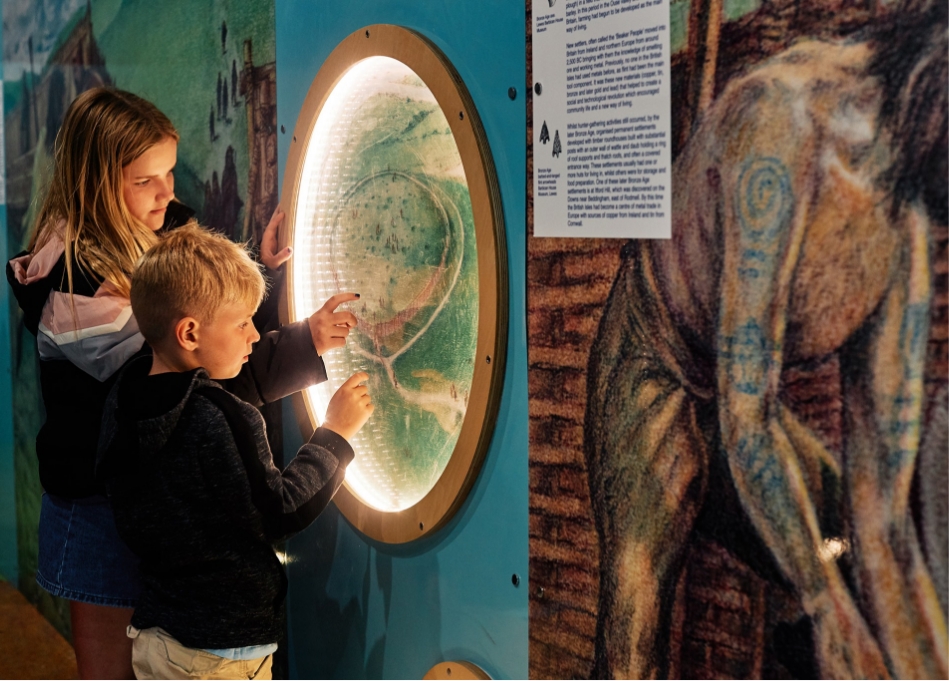 Two children interacting with an exhibit